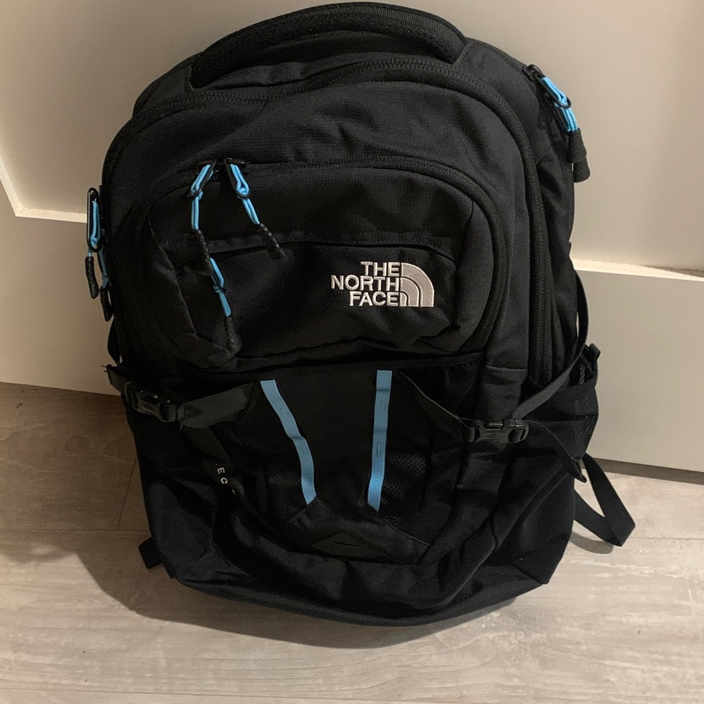 North face backpack black with blue trim. Mens/Womens